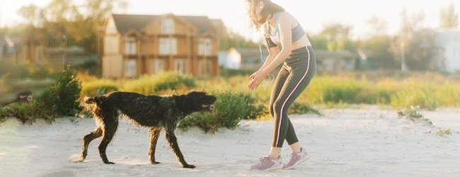 Woman exercising with dog